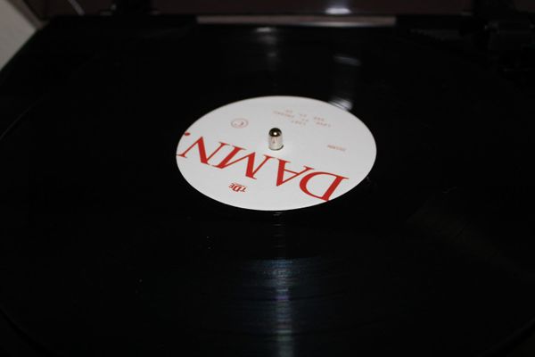 Vinyl record of Kendrick Lamar's album DAMN. on a turntable