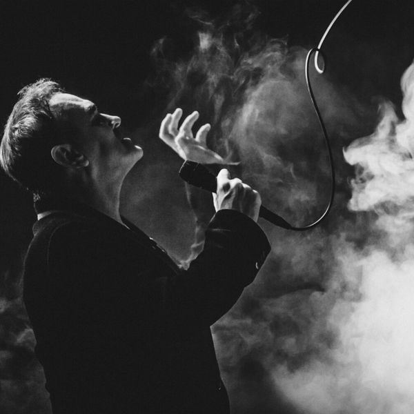 Black and white photograph of Morrissey surrounded by smoke