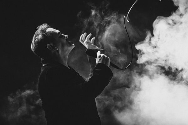 Black and white photograph of Morrissey surrounded by smoke